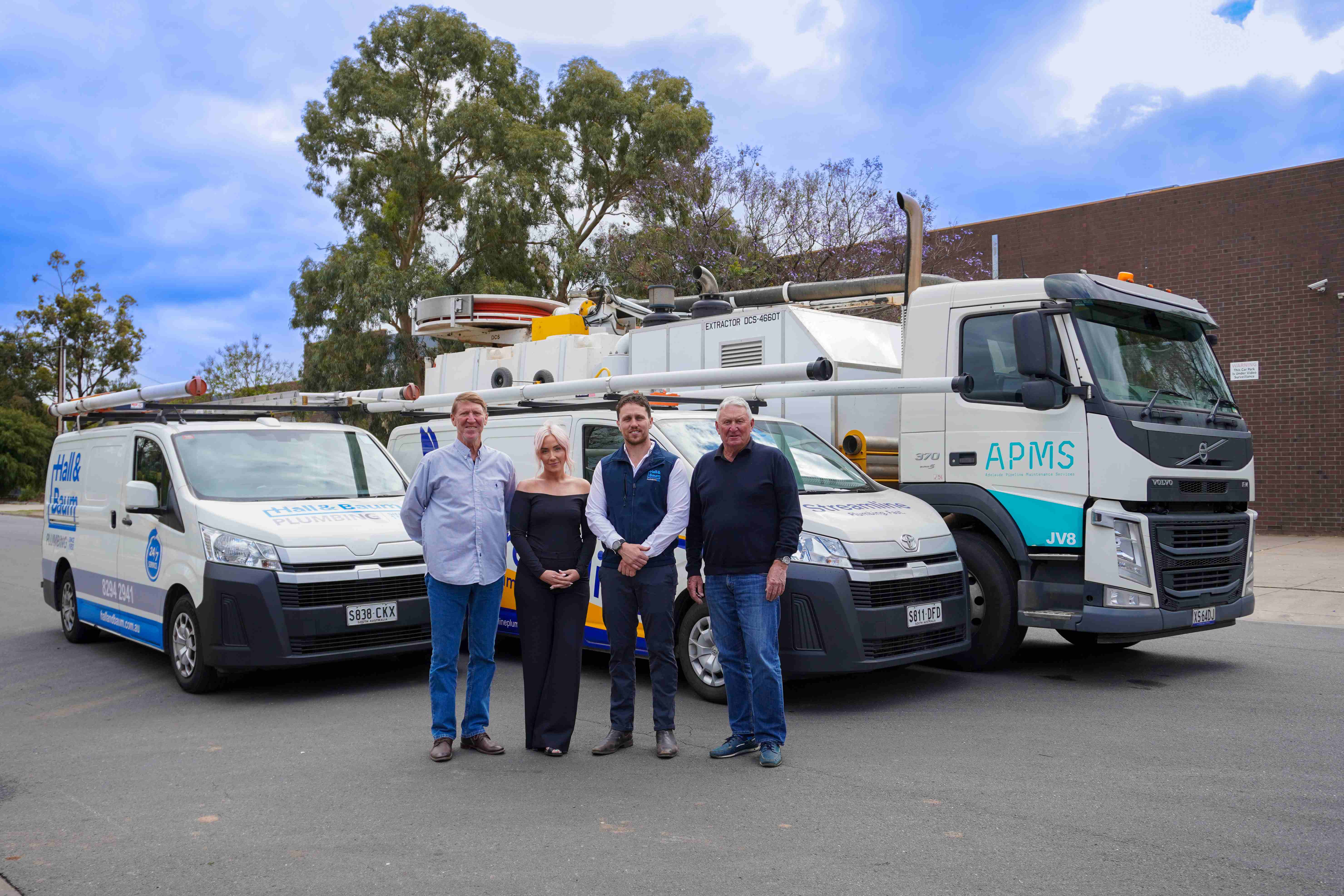 The Hall & Baum family in front of the group's Hall & Baum, Streamline and APMS fleet