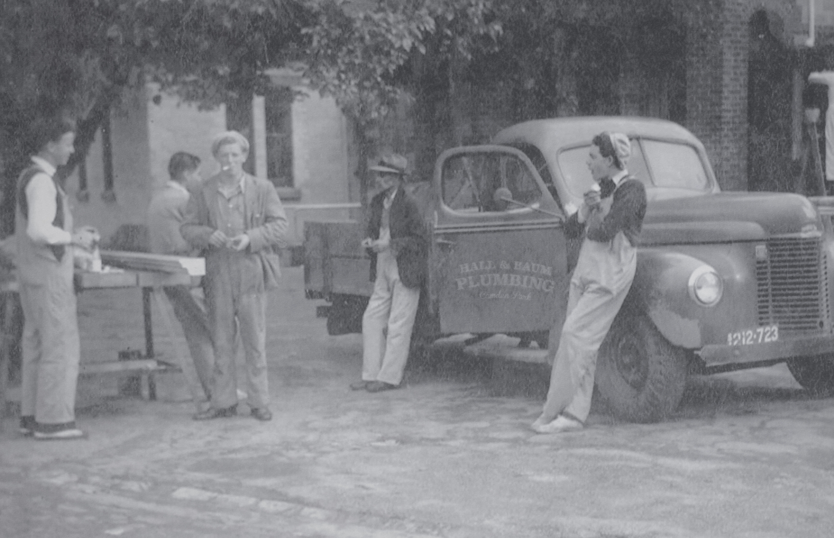 The original Hall & Baum Plumbing truck and crew in the 1950s